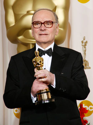 Honorary Academy Award winner Ennio Morricone holds his Oscar backstage at the 79th Annual Academy Awards in Hollywood, California, February 25, 2007.