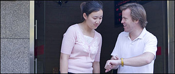 A young couple arrange to meet later